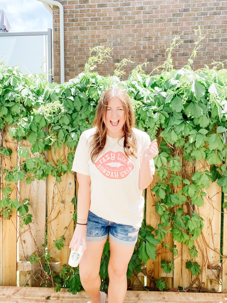 girl wearing an oversozed t-shirt and demin shorts