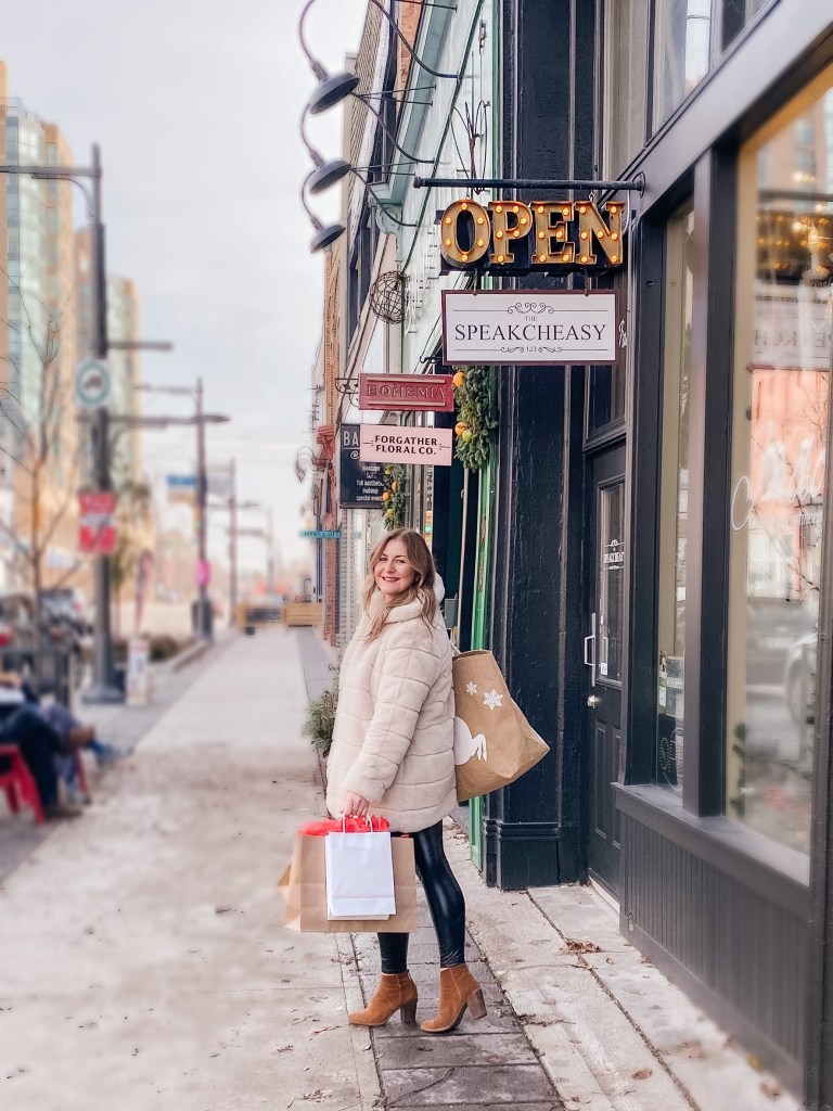 girl with shopping bags Christmas shopping and supporting local